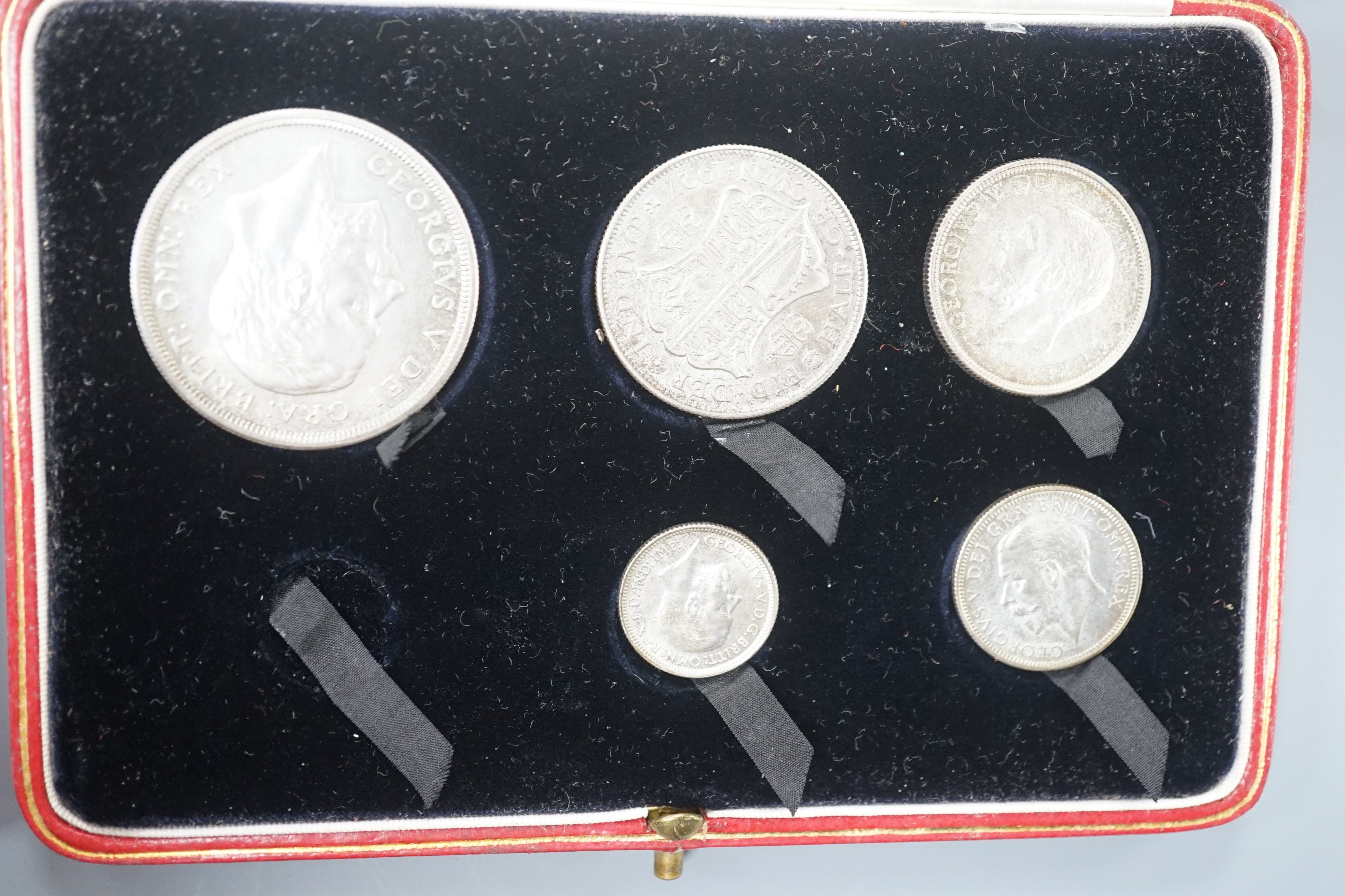 Two George V silver proof coin sets 1927, crown to threepence, (one set missing a threepence), Both sets UNC with toning